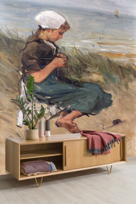 Fotobehang Knitting girl on a dune