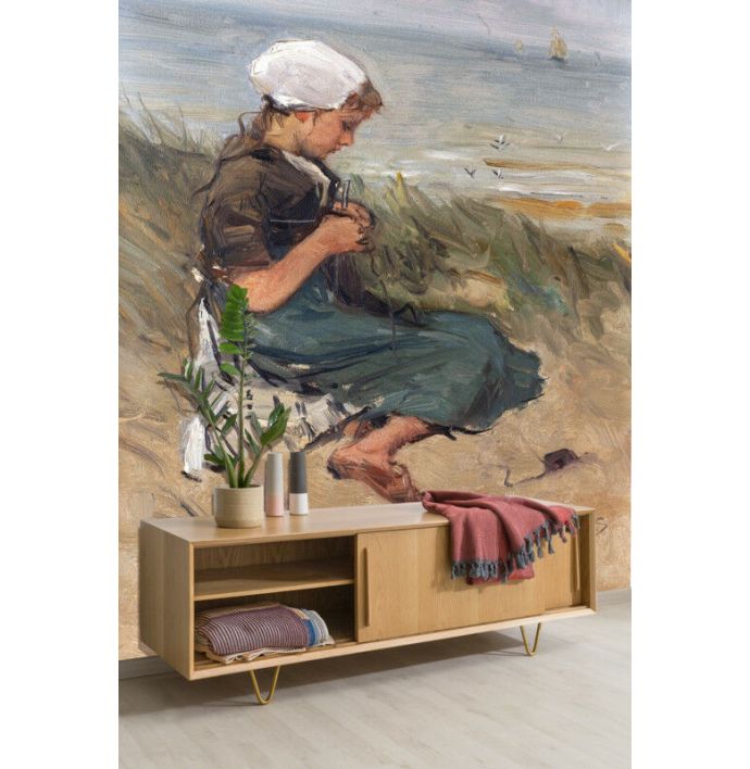 Fotobehang Knitting girl on a dune