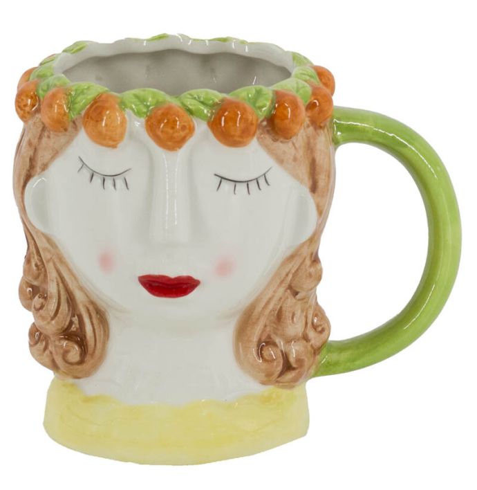 Mok keramiek gezicht sinaasappels