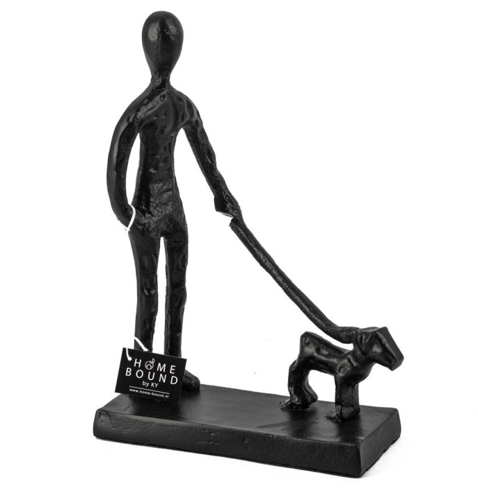 Beeld man met hond zwart